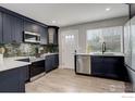 Updated kitchen with quartz countertops, stainless appliances, and new cabinets at 778 S Nome St, Aurora, CO 80012