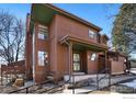 Attractive two-story home with large windows and a welcoming front porch, enhanced by elegant trim at 8015 Holland Ct # A, Arvada, CO 80005