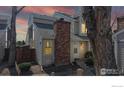Exterior view of a cozy townhome showcasing architectural details and a serene atmosphere at dusk at 8300 W 87Th Dr # B, Arvada, CO 80005