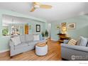 Comfortable living room with hardwood floors, neutral paint, and stylish decor at 884 Ithaca Dr, Boulder, CO 80305