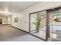 Well-maintained hallway features secure access doors, neutral decor, and convenient accessibility at 1053 W Century Dr # 110, Louisville, CO 80027