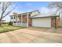 This charming home includes a two-car garage and ample driveway space for multiple vehicles at 10805 Verna Ln, Northglenn, CO 80234