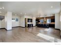 Expansive living room featuring hardwood floors, sleek design, and an open layout perfect for entertaining at 1778 Peak Loop, Broomfield, CO 80023