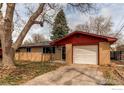 Charming brick ranch-style home featuring an attached one-car garage and a well-kept front yard with a driveway at 312 Buckley Dr, Longmont, CO 80501