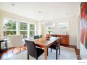 Bright dining room with hardwood floors, modern lighting and view to outside at 3265 6Th St, Boulder, CO 80304