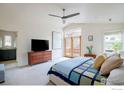 Bright main bedroom with vaulted ceiling, ceiling fan, and access to a private balcony at 3265 6Th St, Boulder, CO 80304