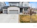 Charming two-story home with a covered porch and three-car garage at 4621 Prairie River Ct, Longmont, CO 80504