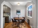 Bright dining area featuring hardwood floors and a window view at 1130 N Pennsylvania St # 306, Denver, CO 80203