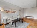 This living room has a cozy rug, hardwood floors and bench seating at 1130 N Pennsylvania St # 306, Denver, CO 80203