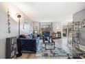 Cozy living room features modern flooring, comfortable seating, and abundant natural light at 1561 S Sheridan Blvd, Lakewood, CO 80232