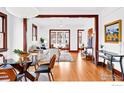 Bright living room with hardwood floors, large windows, and a cozy seating area at 1741 Pine St, Boulder, CO 80302
