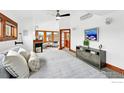 Spacious main bedroom with fireplace, ensuite, and a ceiling fan at 1741 Pine St, Boulder, CO 80302