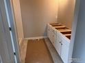 Bathroom featuring a vanity with white cabinets and tile flooring at 2261 Peregrine Dr, Brighton, CO 80601