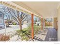 Covered front porch offering ample space for seating and enjoying neighborhood views at 2607 Thornbird Pl, Boulder, CO 80304