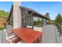 Inviting deck with modern furniture, offering panoramic views of the surrounding landscape at 274 Boulder View Rd, Boulder, CO 80302