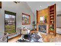 Inviting living room boasts a fireplace and ample natural light at 3264 Cripple Creek Trl, Boulder, CO 80305