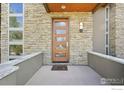 Inviting front entrance features a modern door with glass panels and stone facade at 350 15Th St, Boulder, CO 80302