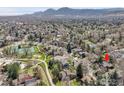 Aerial view showcases the home's location, mountain views and neighborhood at 3885 Birchwood Dr, Boulder, CO 80304
