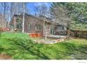 Spacious backyard features mature trees and a deck, perfect for outdoor entertaining at 3885 Birchwood Dr, Boulder, CO 80304