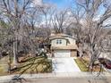 Elevated view of a home in a serene neighborhood, surrounded by lush greenery at 4275 Corriente Pl, Boulder, CO 80301