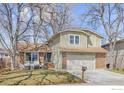 Charming two-story home with an attached two-car garage and landscaped front lawn at 4275 Corriente Pl, Boulder, CO 80301