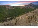 Expansive mountain view showcasing the home's secluded location and natural beauty at 450 Melvina Hill Rd, Boulder, CO 80302