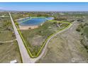Aerial view of a large parcel of land with lake access, showcasing the property's unique boundary at 4514 Hoot Owl Dr, Berthoud, CO 80513