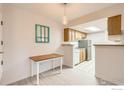 Bright dining area adjacent to kitchen, creating an open and functional space at 8335 Fairmount Dr # 207, Denver, CO 80247