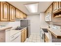 Functional kitchen with stainless steel appliances and light wood cabinetry, ready for cooking and entertaining at 8335 Fairmount Dr # 207, Denver, CO 80247