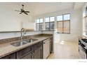 Updated kitchen with granite countertops, stainless steel appliances, and dual sink at 1200 Yarmouth Ave # 239, Boulder, CO 80304
