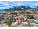 Aerial view of a home with mountain views in a neighborhood at 1525 Judson Dr, Boulder, CO 80305