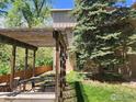 Backyard patio with outdoor seating under a wooden pergola at 1607 Cottonwood Dr # 14, Louisville, CO 80027