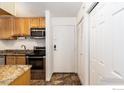 Functional kitchen featuring stainless steel appliances, granite countertops, and ample cabinet space for storage at 3250 Oneal Cir # H17, Boulder, CO 80301