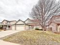 Traditional two-story home boasts a three-car garage and landscaping at 412 E 131St Ave, Thornton, CO 80241