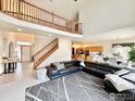 Spacious living room with an open floorplan and staircase at 412 E 131St Ave, Thornton, CO 80241