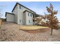 Multi-level backyard with wooden deck and patio, ideal for outdoor entertaining at 4426 Sidewinder Loop, Castle Rock, CO 80108