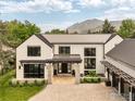 Beautiful home exterior featuring a stone accent entryway and mountain views in the background at 706 Juniper Ave, Boulder, CO 80304