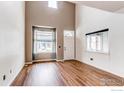 Inviting living room with hardwood floors, lots of light, and a neutral color scheme at 828 Kane Dr # 35, Longmont, CO 80501
