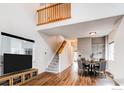 Bright living area with staircase, high ceilings, and wood floors is great for entertaining at 828 Kane Dr # 35, Longmont, CO 80501
