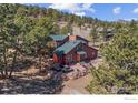 Beautiful, wooded home site with a large yard, mature trees and an inviting exterior at 8543 Middle Fork Rd, Boulder, CO 80302