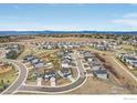 Panoramic aerial view of a residential community featuring multiple homes and landscaped common areas at 100 Stinson Pl, Castle Pines, CO 80108