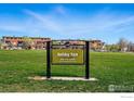 Holiday Park features a lush green space and mature trees with a neighborhood in the background at 1351 Yellow Pine Ave, Boulder, CO 80304
