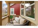 Inviting front porch with comfortable seating, perfect for relaxing and enjoying the neighborhood at 14214 Waterside Ln, Broomfield, CO 80023