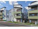 Contemporary exterior view of modern multi-story homes at 1615 Harlan St # 2, Lakewood, CO 80214