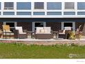 Cozy patio with brick and concrete, showcasing comfortable chairs and small tables at 205 Lucerne Dr, Lafayette, CO 80026