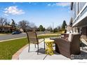 Relaxing patio with an assortment of chairs and tables overlooking the street at 205 Lucerne Dr, Lafayette, CO 80026