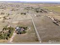 Expansive property with two homes and a long driveway surrounded by beautiful country land at 2610 W County Road 4, Berthoud, CO 80513