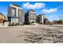 A group of modern townhomes with unique architectural details, each with rooftop access at 2625 W 25Th Ave # 7, Denver, CO 80211