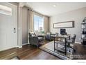 Comfortable home office with plush seating, stylish decor, and plenty of natural light at 4201 Sandstone Dr, Mead, CO 80504