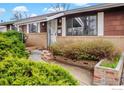 Charming single-story home featuring a well-manicured front yard and brick accents at 4560 Hanover Ave, Boulder, CO 80305